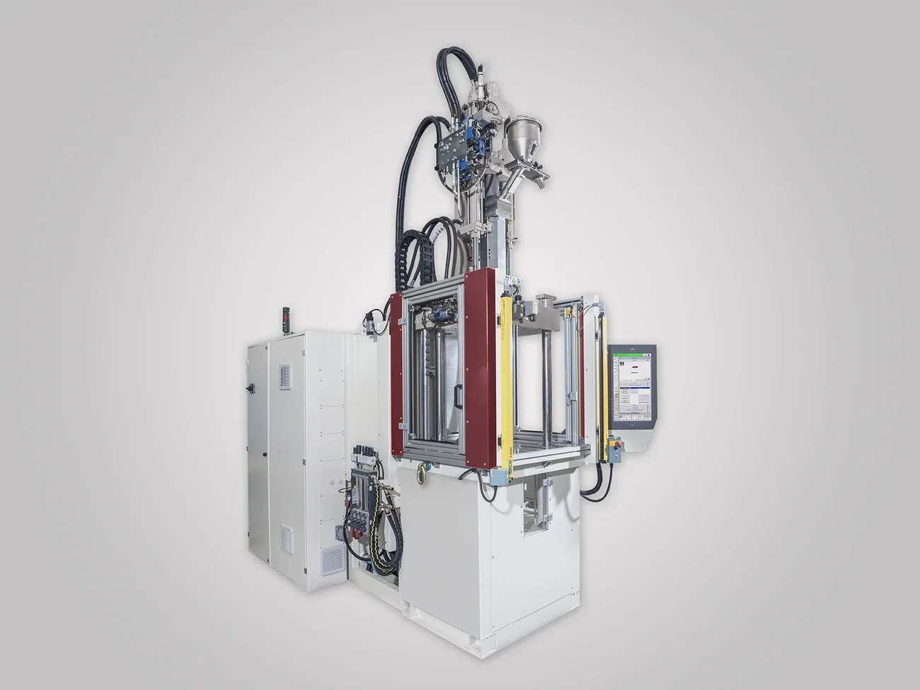 WITTMANN BATTENFELD VM 100/130 - официальная вертикальная машина для insert molding